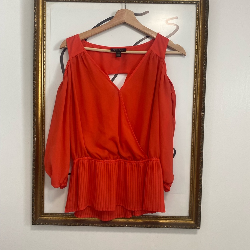 Thalia Sodi orange cold shoulder blouse.